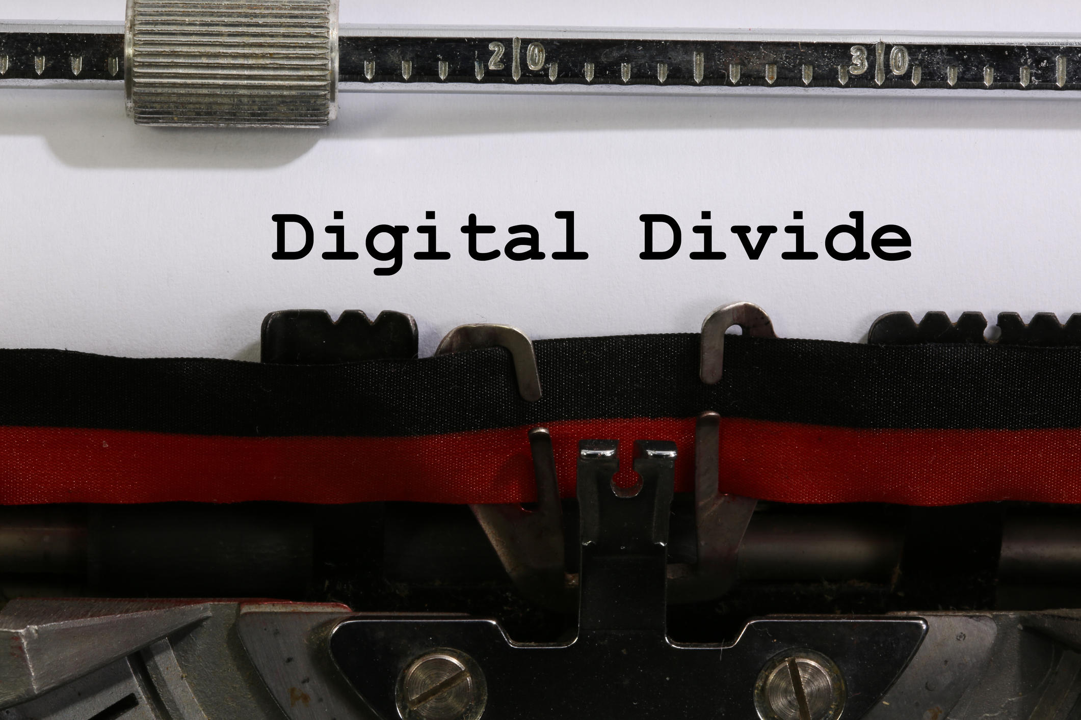 Text Digital Divide written with the old typewriter