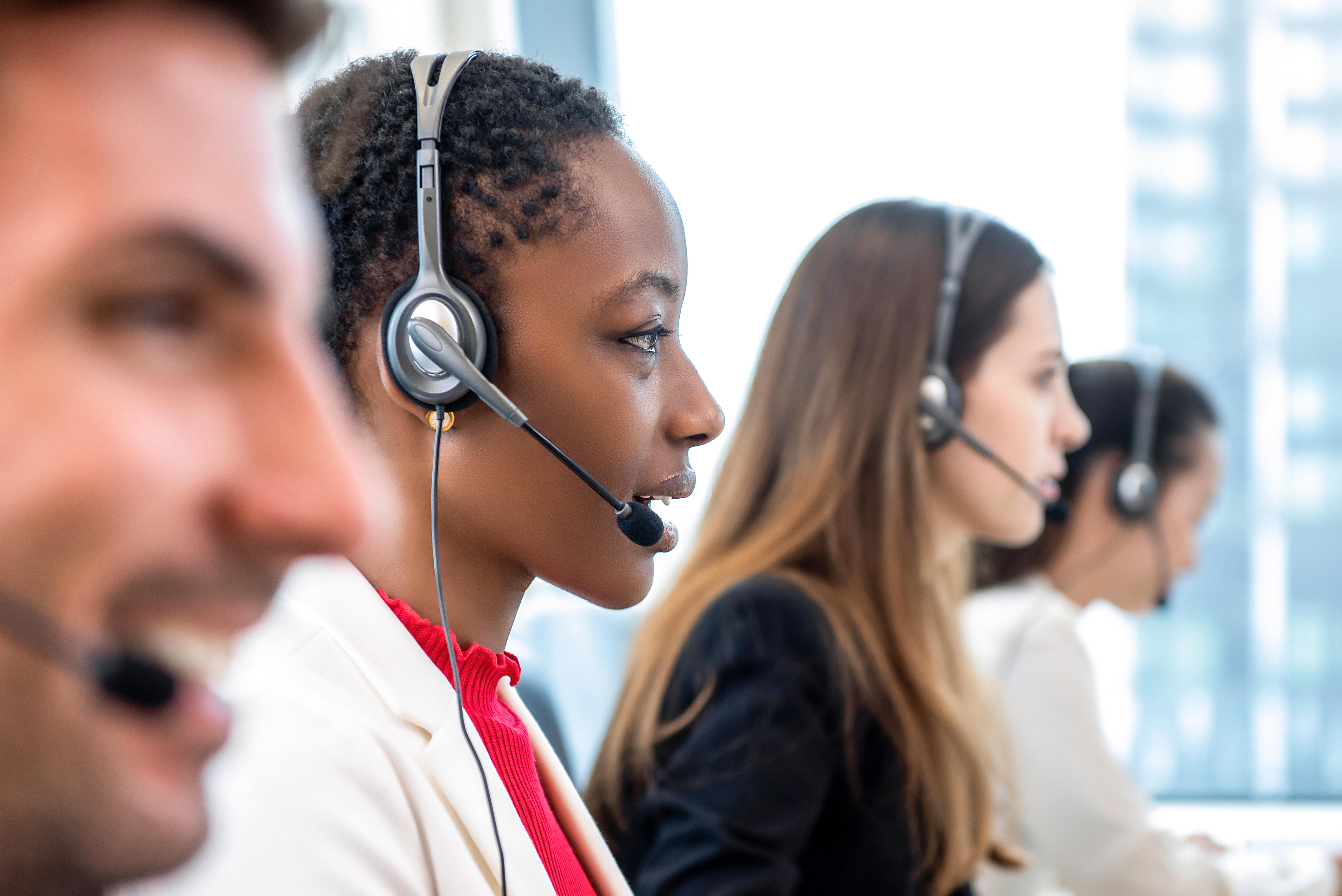 Diverse call center team working in office