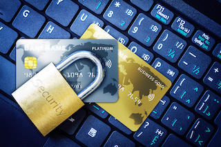Padlock on Top of Credit Cards on Keyboard Cyber Security Concept