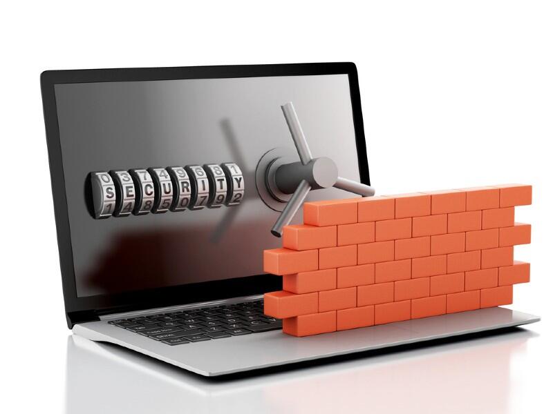 A wall in front of a computer