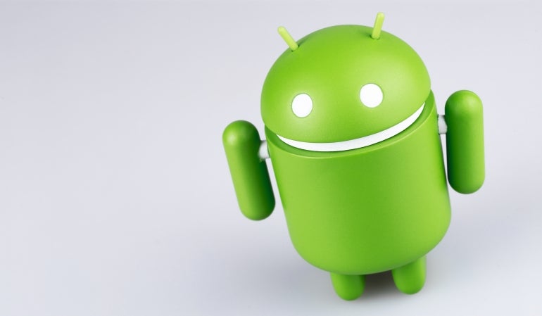 Google Android figure on grey background. Google Android is the operating system for smartphones, tablet computers, e-books, game consoles, and other devices.