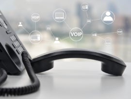 A phone with icons that say VOIP.