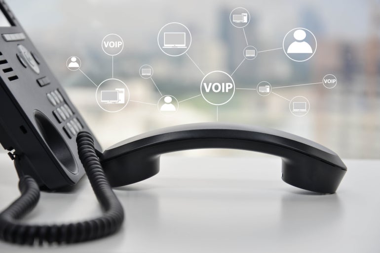 A phone with icons that say VOIP.