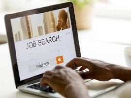 African-american man browsing work online using job search computer app