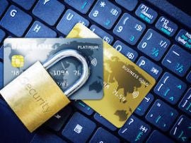 Padlock on Top of Credit Cards on Keyboard Cyber Security Concept