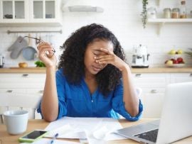 Woman working from home, stressed