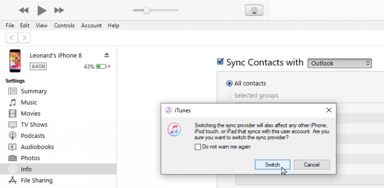 "Sync Contacts with Outlook" option under iTunes.