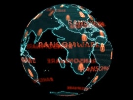 Digital globe on a black background with ransomware woven through the continents