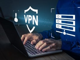 VPN secure connection concept. Person using Virtual Private Network technology on laptop computer to create encrypted tunnel to remote server on internet to protect data privacy or bypass censorship