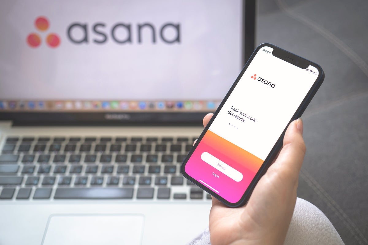 Asana logo on laptop and mobile phone.