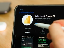 Microsoft Power BI logo shown by apple pencil on the iPad Pro tablet screen.