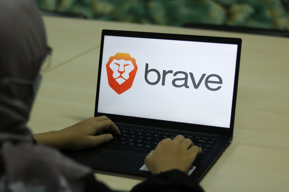 Laptop featuring Brave logo.