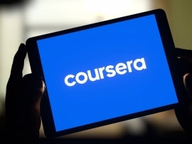 Logo of online learning platform Coursera displayed on tablet screen.