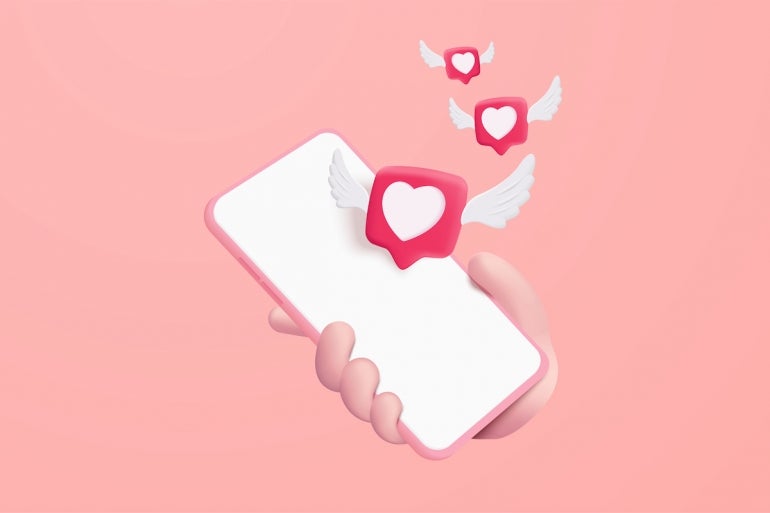 3d heart and love with wings is flying on mobile phone in holding hand. social media online emoji icon platform concept, communication on application. 3d heart with wings vector render illustration