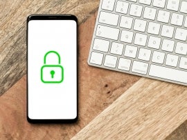 Green padlock icon on a smartphone screen, web and network protection, security and anonymity symbol