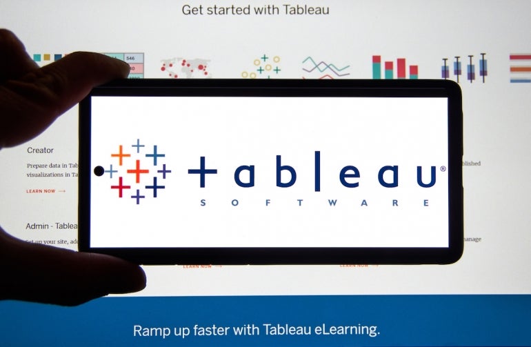 Tableau application and logo on android cellphone over a chart.