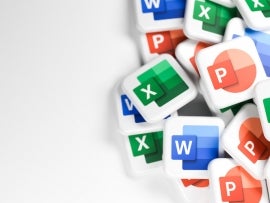 Logos of the Microsoft Office components Word, Excel, Powerpoint on a heap. Copy space. Web banner format.