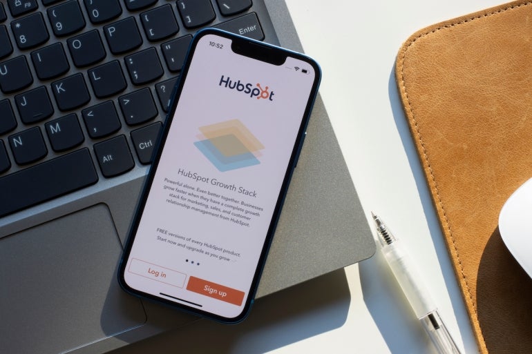 HubSpot mobile app login page is seen on an iPhone. HubSpot offers a full platform of marketing, sales, customer service, and CRM software.
