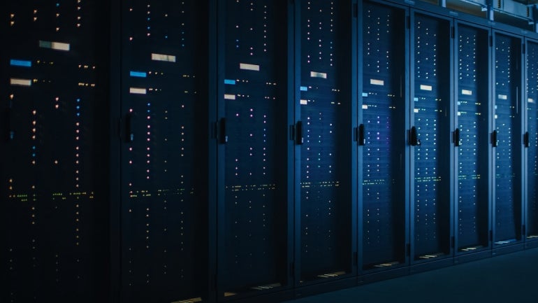 Shot of Dark Data Center With Multiple Rows of Fully Operational Server Racks. Modern Telecommunications, Cloud Computing, Artificial Intelligence, Database, Supercomputer.