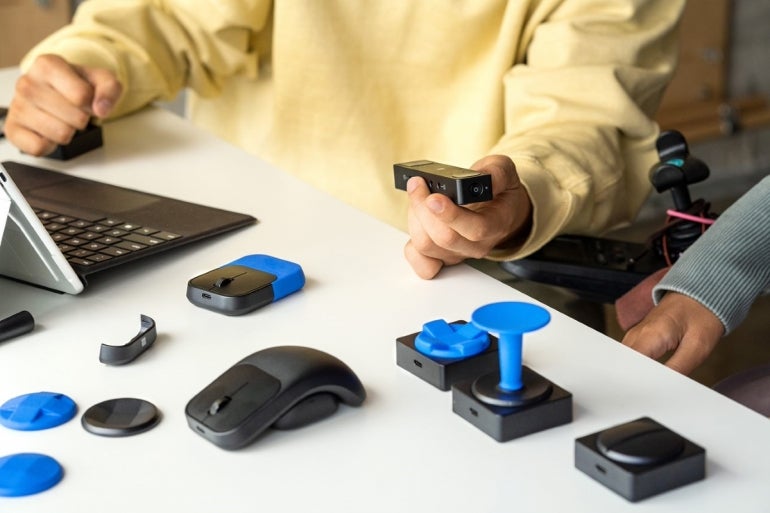 Microsoft accessories, including a mouse and controller parts