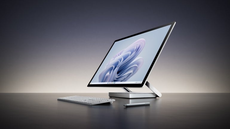 a Surface Studio 2+ device with a keyboard and stylus