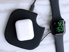 Teamwork wireless charger charging airpods and an Apple Watch.
