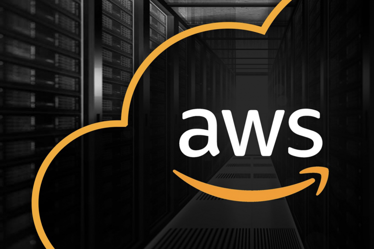 The Amazon Web Services logo in front of a server room.