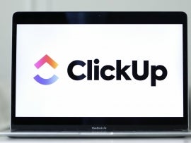 Logo of ClickUp presented on a laptop screen.
