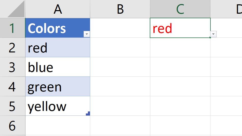 A table in Excel with Colors, red, blue, green, and yellow listed in column A and the word red in red font in cell C1