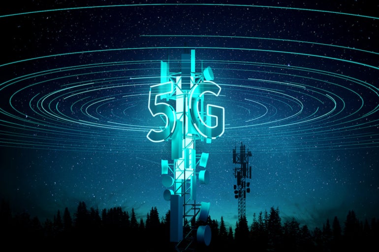 A cellphone tower with 5G lit up in blue.
