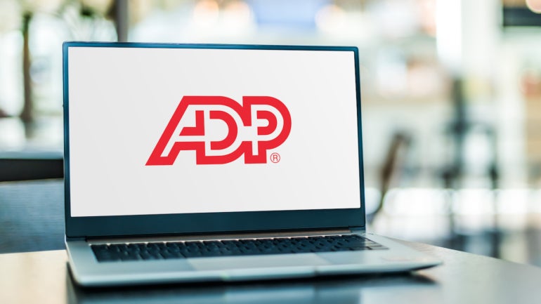 The ADP logo on a laptop.