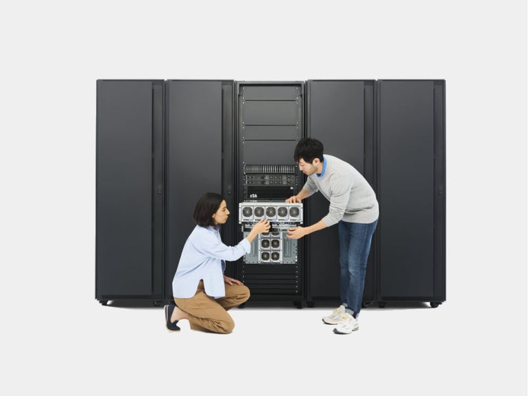 IBM demonstrates the installation of a rack mount as it might be used in a data center.