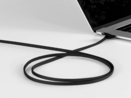 The inCharge X Max 100W Charging Cable connected to a laptop.