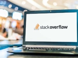 Stack Overflow logo on the laptop screen.