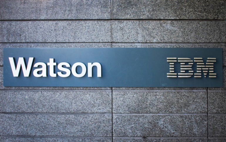 A sign with the Watson and IBM logos.
