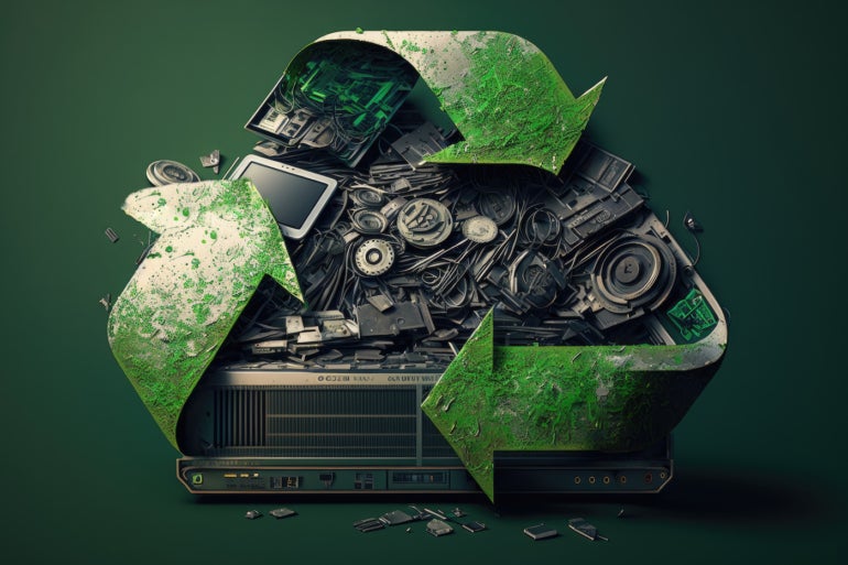 Image of a recycling logo with a pile of electronic waste in the middle.