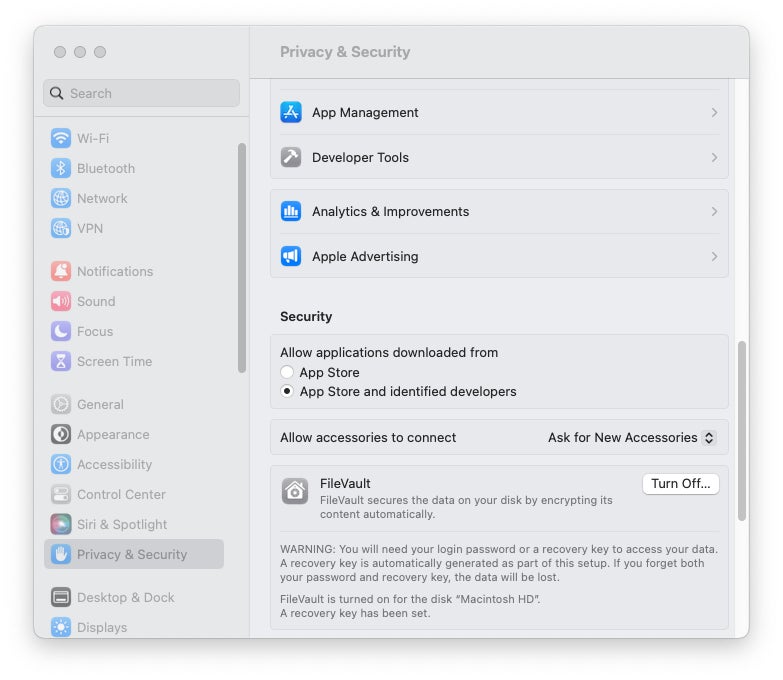 Mac System Settings' Privacy & Security pane featuring the FileVault settings.