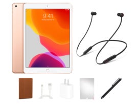 An iPad and Beats headphones with all of the accessories.